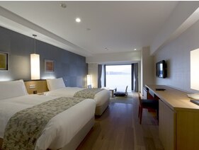 【スパリゾート館スタンダード和洋室】ベッド2台と琉球畳8畳のお部屋です。
